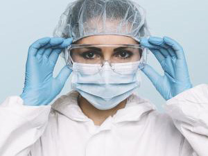 Female Doctor or Nurse Wearing latex protective gloves and medical Protective Mask and glasses on face. Protection for Coronavirus COVID-19 : Stockfoto oder Stockvideo und Fotos, Bilder, Stockmedien von rcfotostock | RC-Photo-Stock