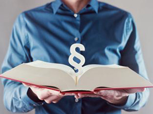 young man holding book with paragraph sign - law concept image : Stockfoto oder Stockvideo und Fotos, Bilder, Stockmedien von rcfotostock | RC-Photo-Stock